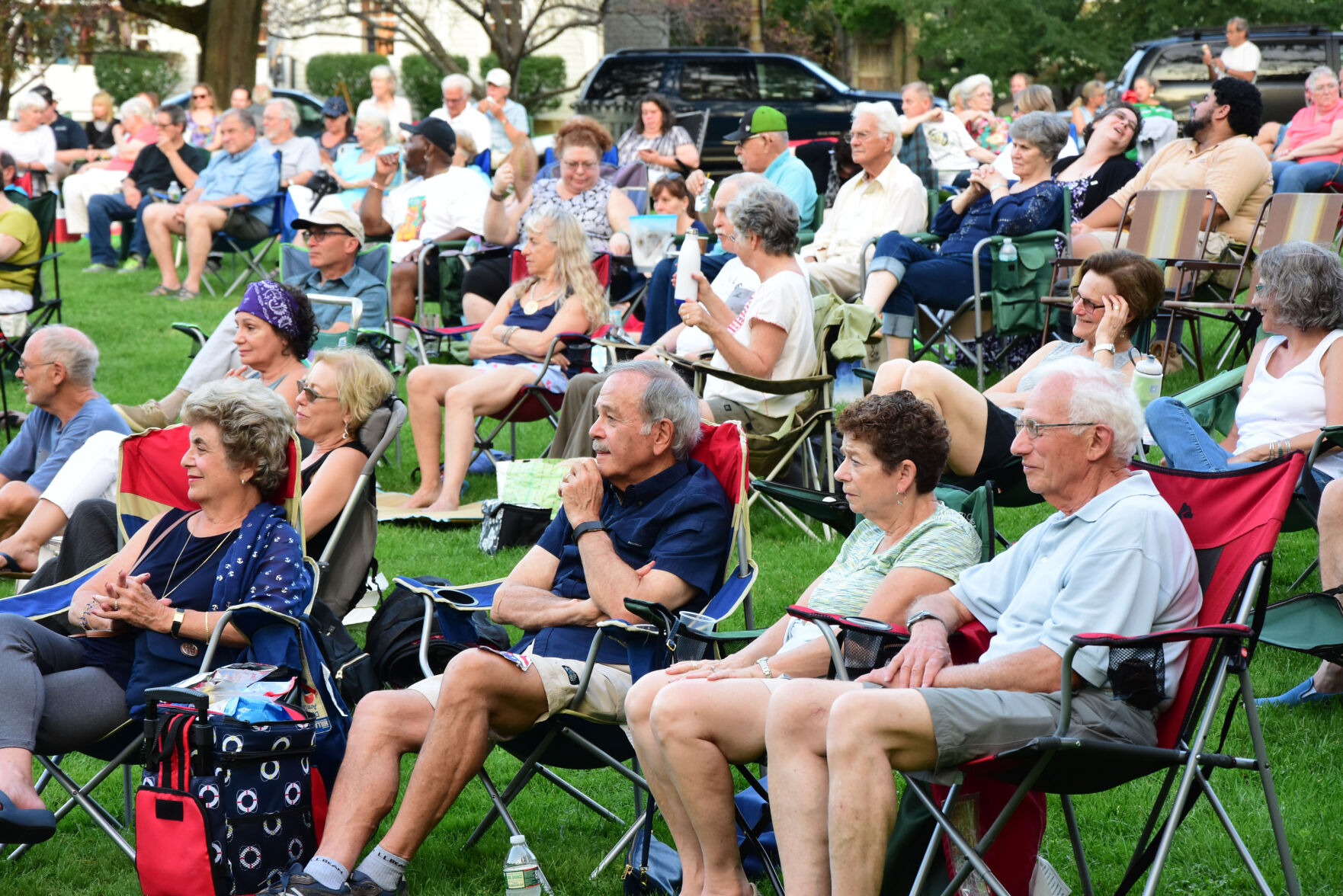 People in chairs on a lawn